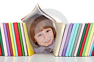 Mischievous kid with freckles and books