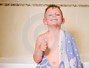 Mischievous little boy in his bath