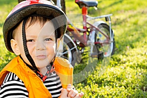 Mischievous little boy in a safety helmet