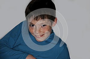 Mischievously smiling teenage  boy