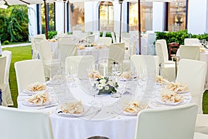 Mise en place of a round table for a wedding event