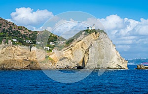 Miseno Cape with lighthouse as seen from the ferry to Procida. Naples, Campania, Italy.