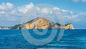 Miseno Cape with lighthouse as seen from the ferry to Procida. Naples, Campania, Italy.