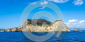 Miseno Cape with lighthouse as seen from the ferry to Procida. Naples, Campania, Italy. photo