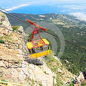 MISHOR, CRIMEA, UKRAINE - MAY 12: People travel by rope way cab on top of Ai-Petri Mountain on May 12, 2013 in Mishor