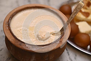 Mishti Doi is a fermented sweet dahi or curd originating photo