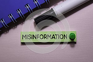 Misinformation text on sticky notes isolated on office desk