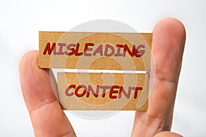 Misleading and fabricated content sign on a white