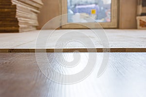 Mismatch levels surfaces when laying a floor - wooden parquet or laminate floor - in building