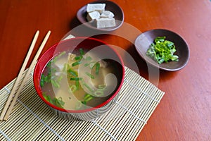 miso soup or Japanese miso soup in bowl on the table. Japanese cuisine in the form of soup with dashi ingredients, tofu, seafood,