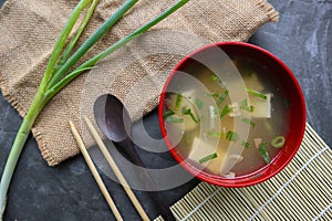 miso soup or Japanese miso soup ,in bowl on the table. Japanese cuisine in the form of soup with dashi ingredients, tofu, seafood,