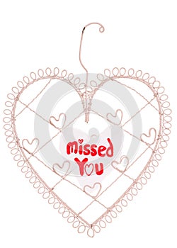 Missed you message on a heart note board