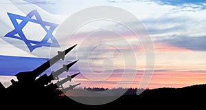 The missiles are aimed at the sky at sunset with Israel flag. Nuclear bomb, chemical weapons, missile defense.