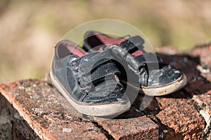 MISSING, abandoned shoes of a child on the street