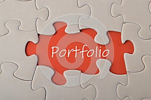 Missing jigsaw puzzle with text PORTFOLIO.A portfolio typically refers to a collection or selection of items or assets, such as