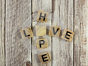 Missing Letter Puzzle Educational Word Game â HOPE and LOVE Crossword Concept on Rustic Table