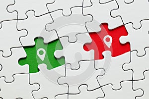 Missing puzzle pieces with map pin location pointer icons. GPS navigation technology