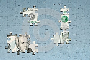 missing puzzle pieces on top of US dollar banknote, concealment of income, default concept