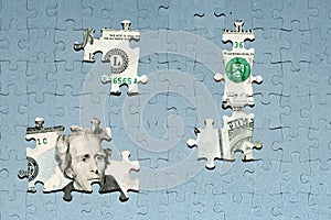 missing puzzle pieces on top of US dollar banknote, concealment of income, default concept photo