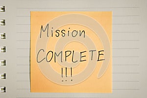 Mission complete words on paper