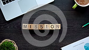Mission word on wooden cubes, plan and goal achievement concept, organization