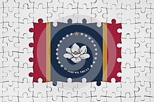 Mississippi new US state flag in frame of white puzzle pieces with missing central part