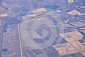 Mississippi River aerial landscape views from airplane over the border of Arkansas and Mississippi. Winding river and Rural town a