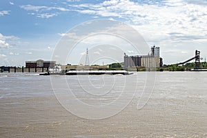 Mississippi river barge,tug boat,grain elevator