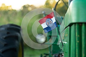 An Missouri flag on a tractor