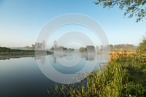 Mist hanging over river Nene in Northamptonshire at sunrise