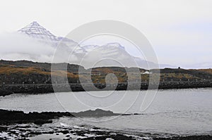 Mist over Djupivogur and the Eggs in GledivÃ­k, Berufjordur in the Eastern Fjords of Iceland photo