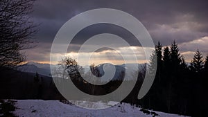 Misty forest and sunrays on the mountains during winter. Slovakia