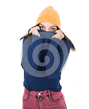 Mistake. Frightened young woman stare to you, covering her mouth with sweater, isolated on white background