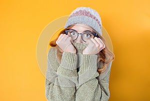 Mistake. Frightened young woman stare to you, isolated on yellow background