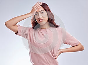 Mistake, regret and young woman in studio with hand on head for anxiety, stress or panic. Portrait of a female model