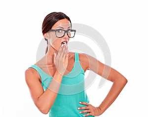 Mistaken caucasian woman with a hand to mouth photo