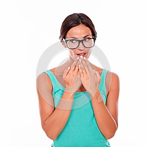 Mistaken caucasian woman with her hands to mouth photo