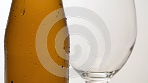 Misted bottle of beer on the table macro