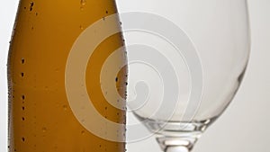 Misted bottle of beer on the table macro