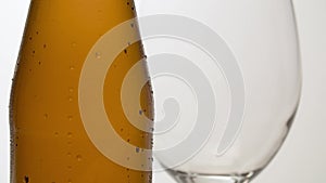 Misted bottle of beer on the table macro