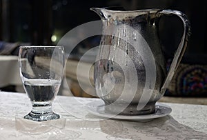 Misted metal jug with cold water