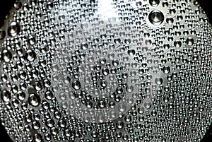 Misted wet glass water drops of dew on the glass abstraction