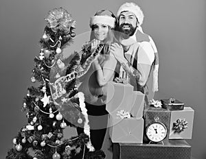 Mister and Missis Claus with red and blue gifts