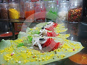 Misti pan, betel nut garnished with all bangali misti paan ingredients for sale.