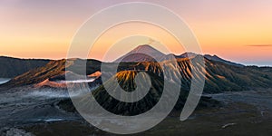 Mistical view on Mount Bromo is an active volcano of Taman Nasional Bromo Tengger Semeru at golden hour sunrise in East Java Ind