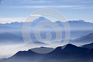 Misty blue Andean mountain landscape background