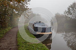 Misty canal with narrow boat