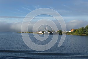 Misty clouds over river bank in the morning