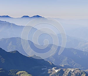 Misty cloudscape with blue mountain scenery