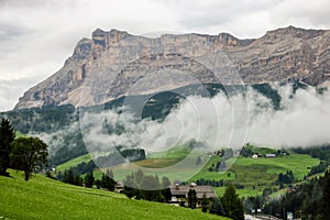 Misty and cloudy alpine landscape